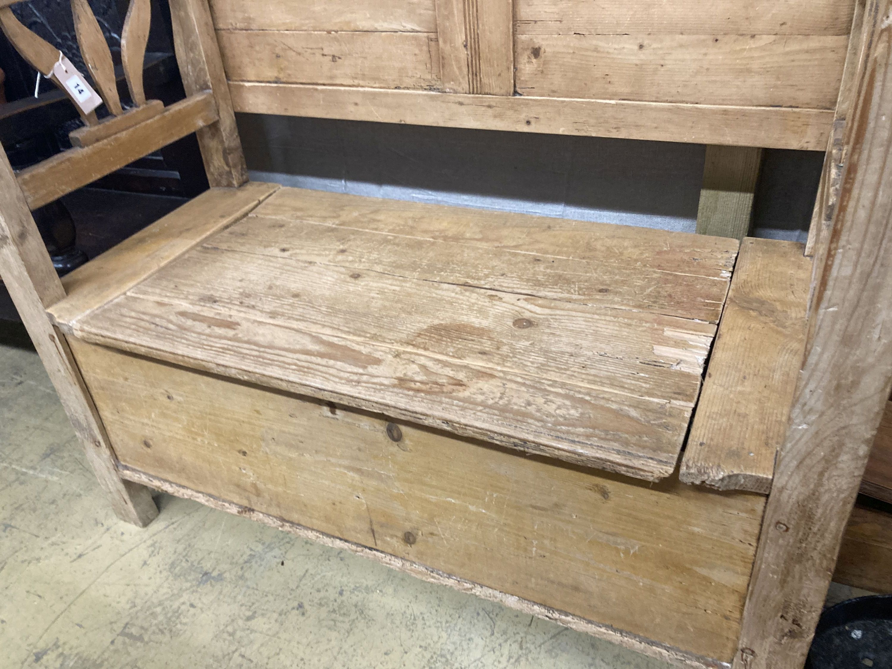 A 19th century East European pine box seat settle, length 110cm, depth 50cm, height 98cm